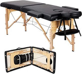 A black-covered portable massage table, suitable for therapists and wellness practitioners on the go.